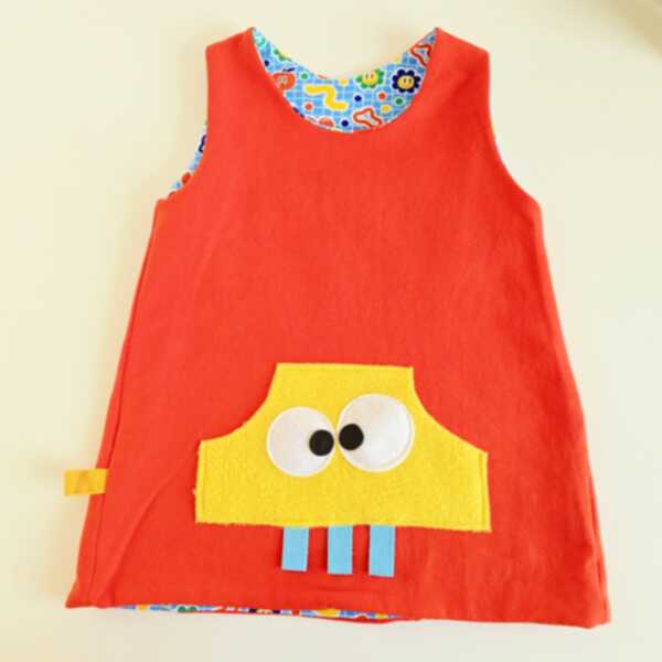 ABITO REVERSIBILE ARANCIO interno simboli celesti